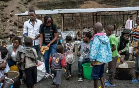 Rochane Uwineza, 27,  is a new volunteer at Goma Actif and is pictured helping distrubute food. 